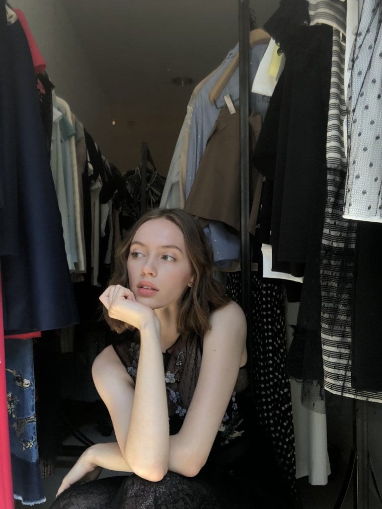 Model Ieva Skruzdytė among the collection during a fitting