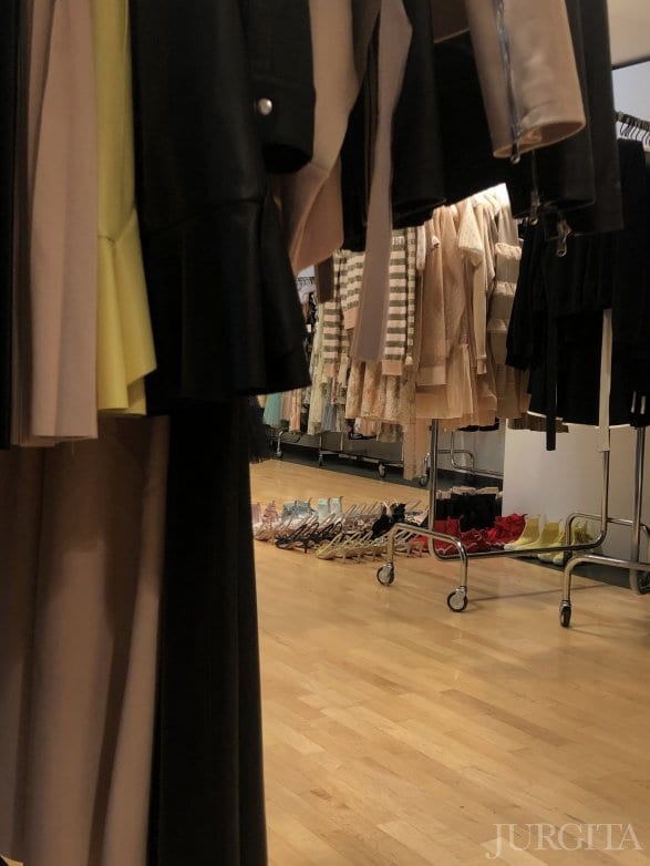 Clothing rails in a fashion house studio during fittings